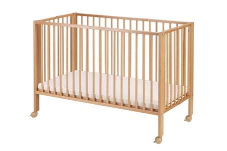 Wooden baby crib with a white mattress and wheels on a white background.