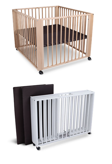 A wooden playpen with a brown mat, and a foldable white playpen with a brown mat.
