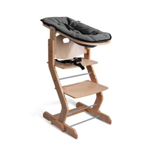 Wooden high chair with removable gray cushion, adjustable footrest, and safety harness. Babyaufsatz