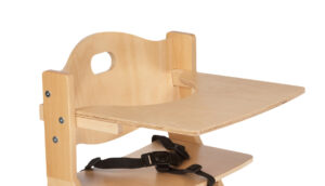 Wooden high chair with adjustable tray and black safety harness.