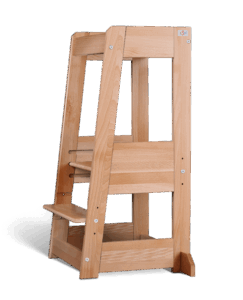 Wooden learning tower with steps and safety rails on a black background.