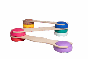 Wooden see-saws balanced on colorful cushions in a playful arrangement.